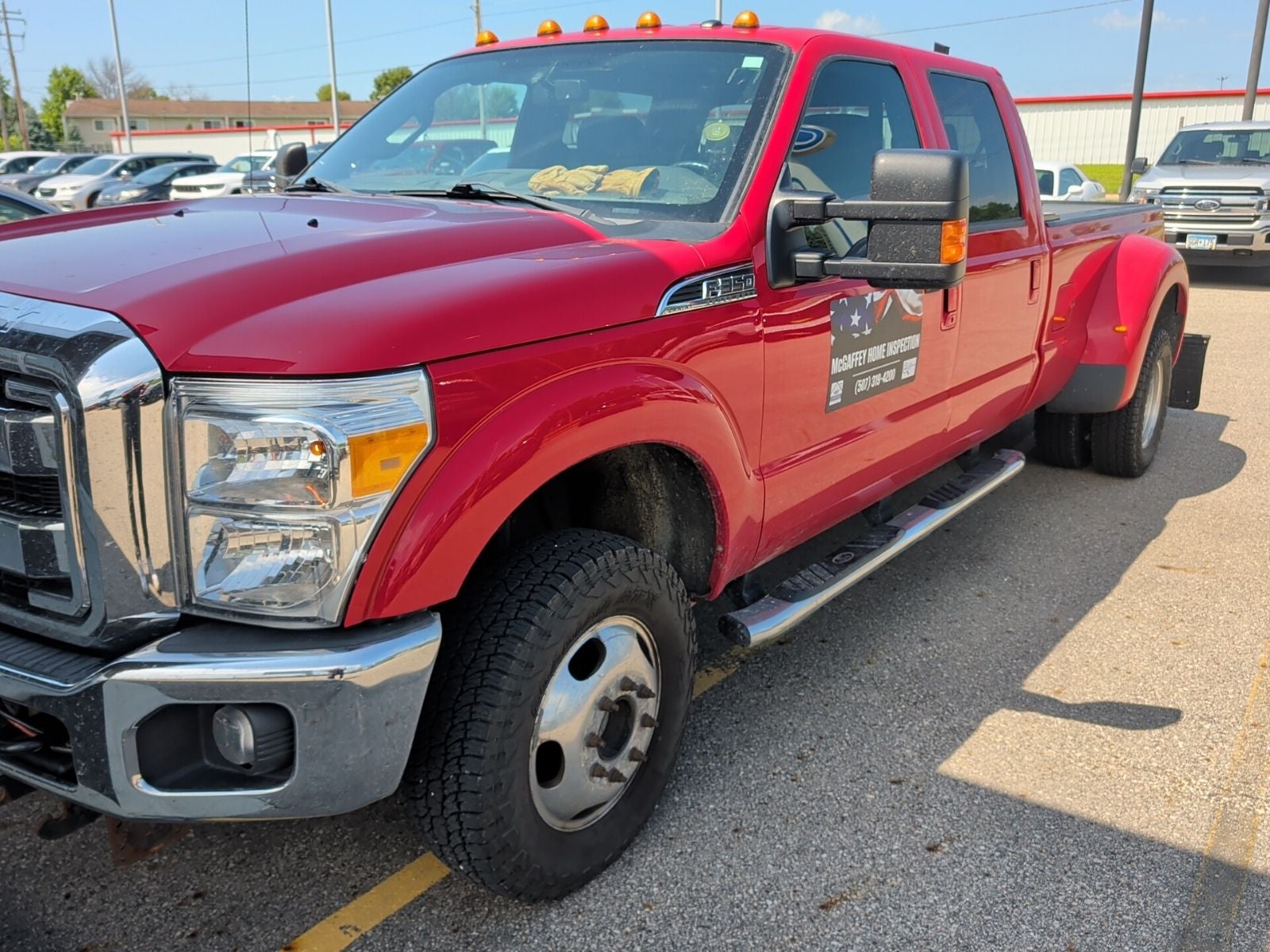 2015 Ford F-350Sd Lariat DUALLY in Vermillion Red — front three-quarter view