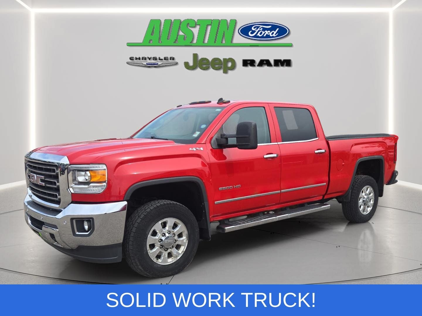 2015 GMC Sierra 2500HD SLT in Fire Red — front three-quarter view