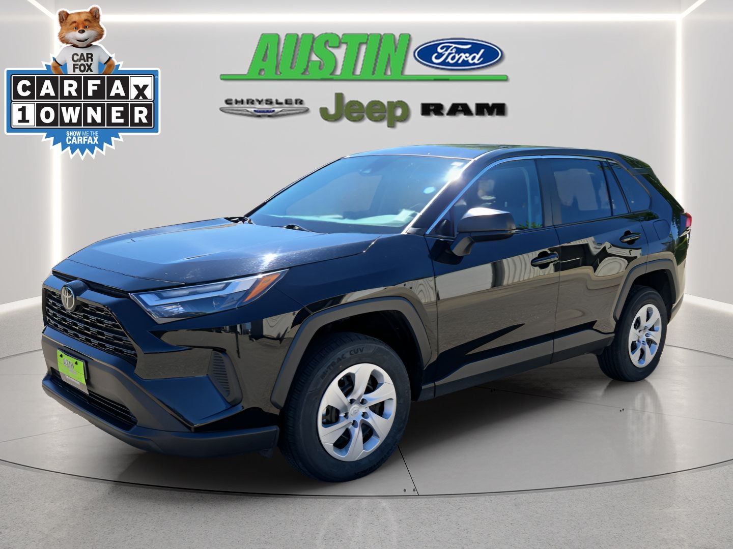 2024 Toyota RAV4 LE in Midnight Black Metallic — front three-quarter view