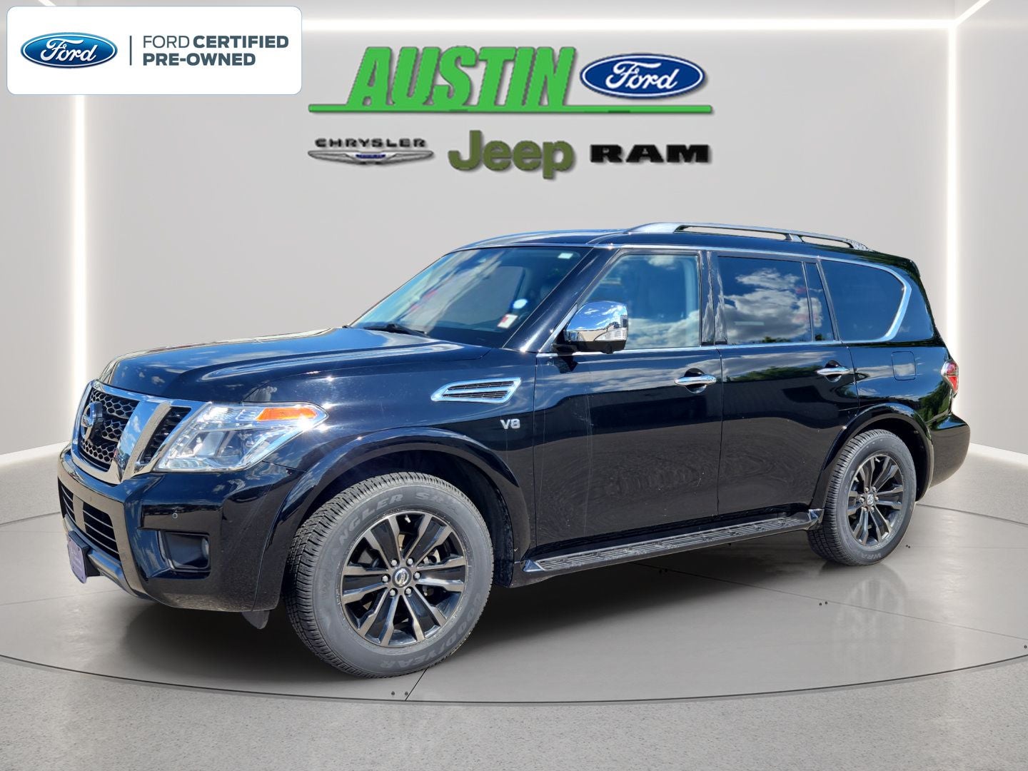 2019 Nissan Armada Platinum in Super Black — front three-quarter view
